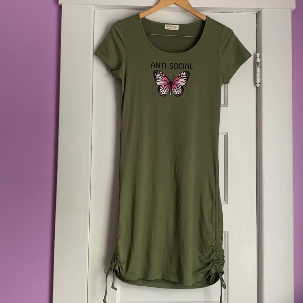 We have a pretty green dress. Super stretchy. Has a butterfly on the front 🦋